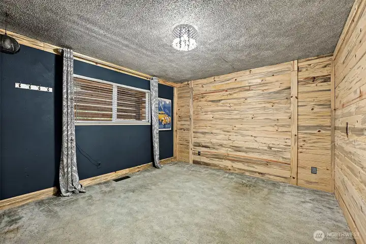 Main floor bedroom features 2 shiplap accent walls.
