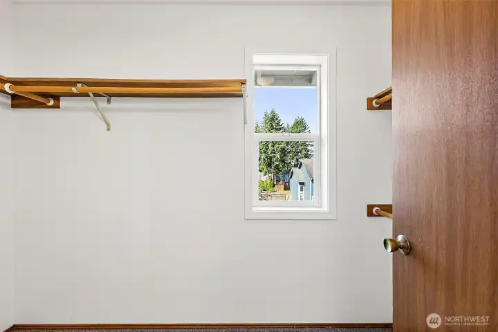 Walk-in closet off the primary bathroom