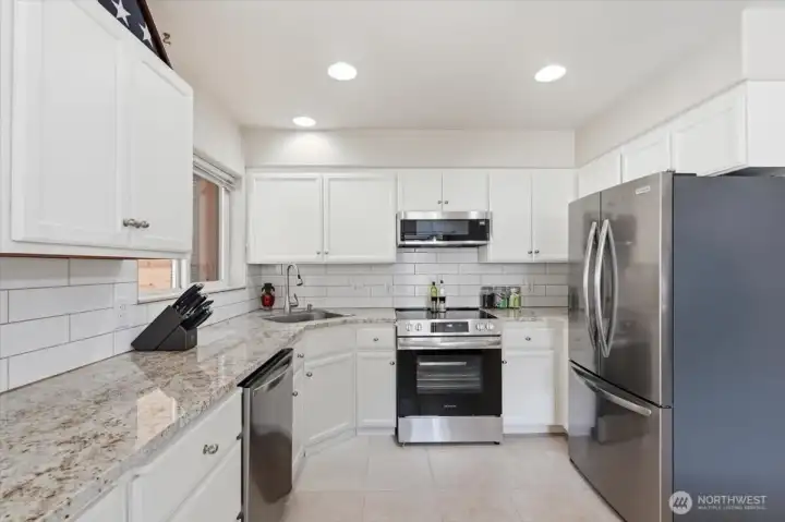 Granite counters, new stainless appliances, tile backsplash,, ceramic tile floors.