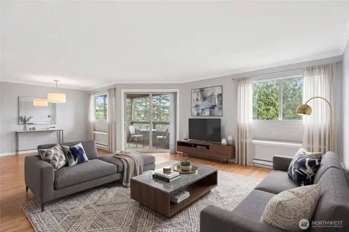 Light-filled living room with modern furnishings and beautiful oversized windows.