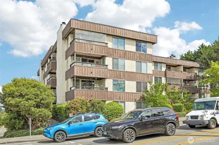 Handsome mid-century modern building surrounded by mature landscaping in a prime West Seattle location.