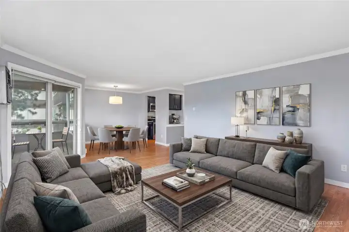 Welcoming living room featuring a plush sectional sofa and stylish coffee table arrangement.