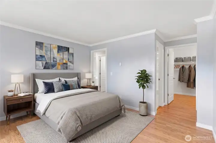 Serene bedroom retreat with hardwood floors, natural light, and a cozy, restful atmosphere.