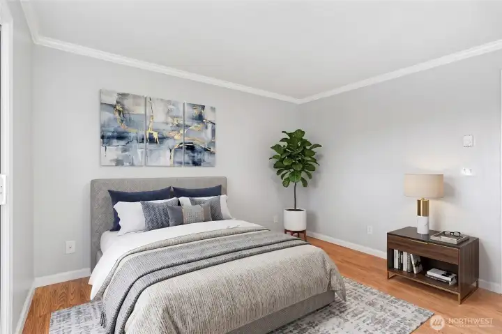 Elegantly appointed bedroom with gallery-worthy artwork and lush indoor greenery.
