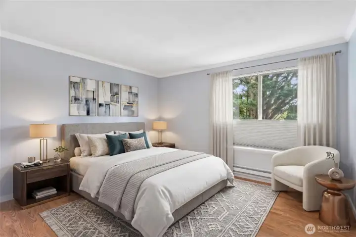 Peaceful primary bedroom with a plush bed, soothing palette, and abundant natural light.