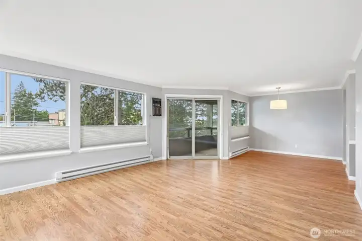 Airy room with expansive sliding glass doors that bathe the space in natural light.