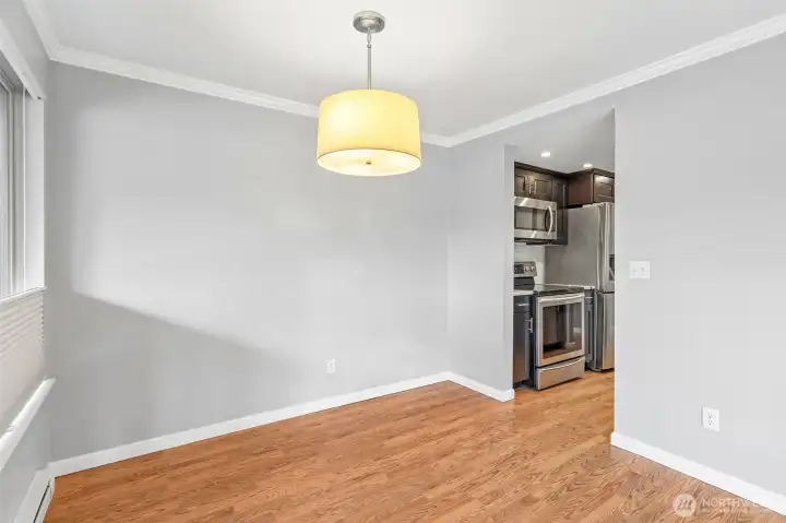 Versatile bonus space with a modern pendant light and convenient closet access.
