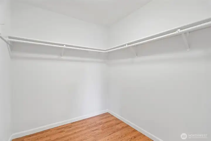 Clean, open room with rich hardwood floors ready to be styled to your taste.