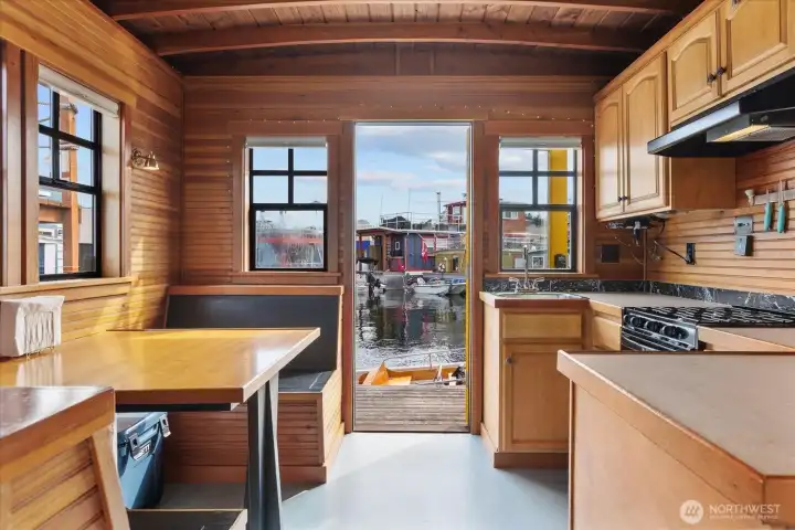 Efficient and surprisingly roomy kitchen with eating nook. (Clouded windows have been replaced) Efficient and surprisingly roomy kitchen with eating nook. (Clouded windows have been replaced)