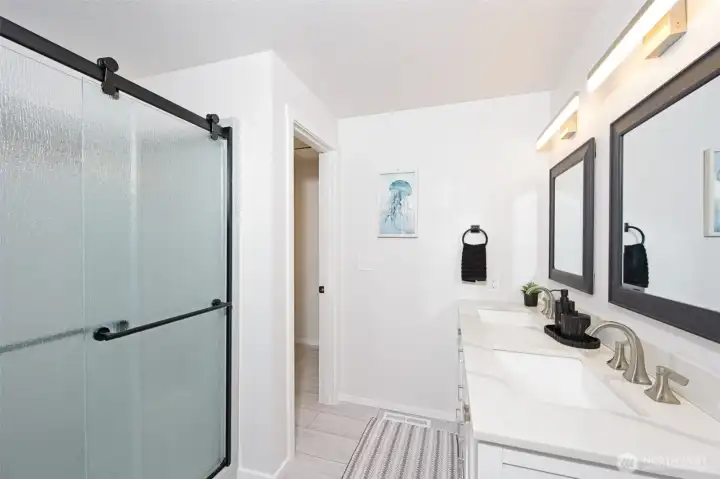 Another view of the nicely updated primary bathroom. Another view of the nicely updated primary bathroom.