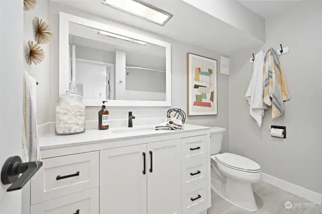 Updated bathroom and vanity with plenty of counter space and storage