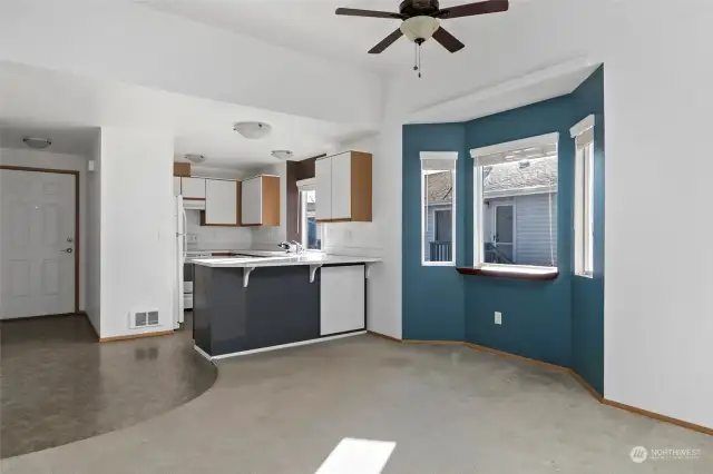 Dining area with ceiling fan.