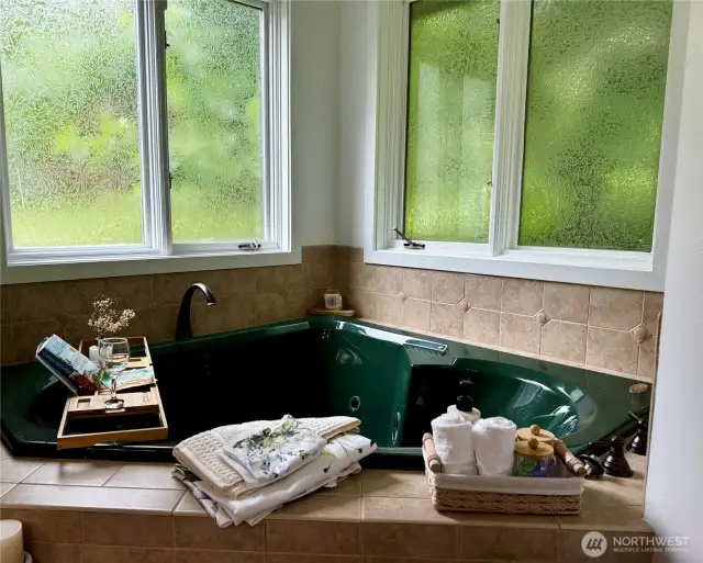 Almost a heart shape cozy spa bath with room for more than one.