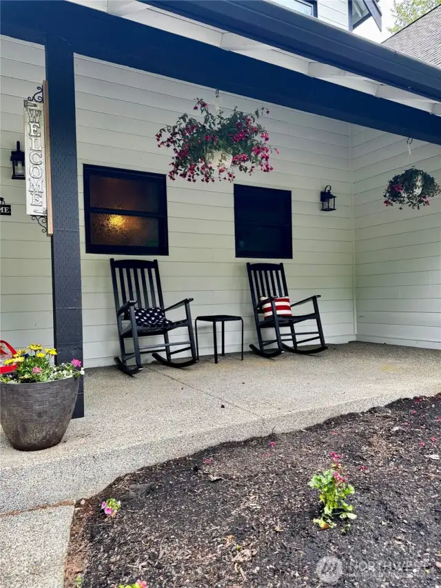 Welcome home! There is room for more of your plants and front porch furniture and decor