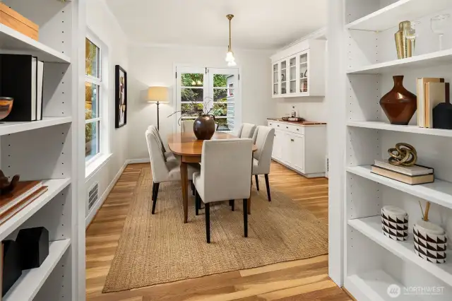 Built-in library shelves flank the entrance to the dining room.