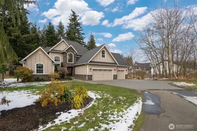 Privately situated at the end of a paved, shared driveway this home is eye-catching! With the stone accents and architectural details, you can tell this was a custom built home and very well maintained.