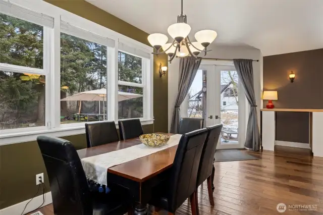 Looking across the formal dining room with the French doors that lead out to the rear yard and patio.