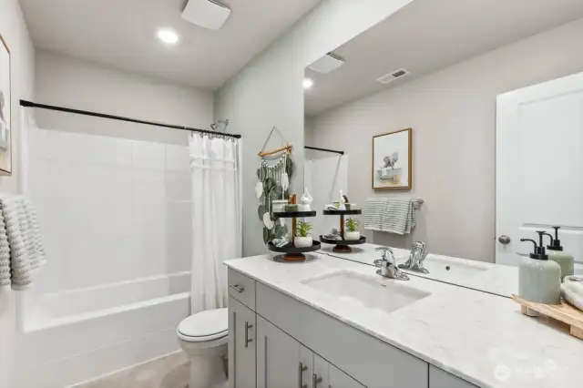 Full hall bathroom on upper level. Pictures are representative of Burnham floorplan. Colors and options will vary. Photos from Model Home on 30. Homesite 77 is a mirror image.