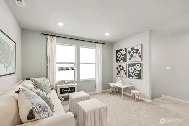 Centralized spacious loft on upper level as well! Pictures are representative of Burnham floorplan. Colors and options will vary. Photos from Model Home on 30. Homesite 77 is a mirror image.