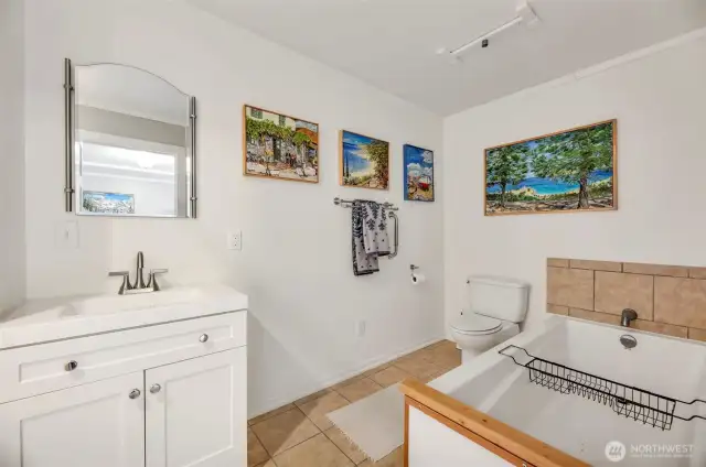 This bathroom has a tub/shower combo as well as a soaking tub.