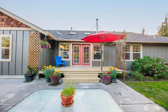 Backyard patio with small deck.