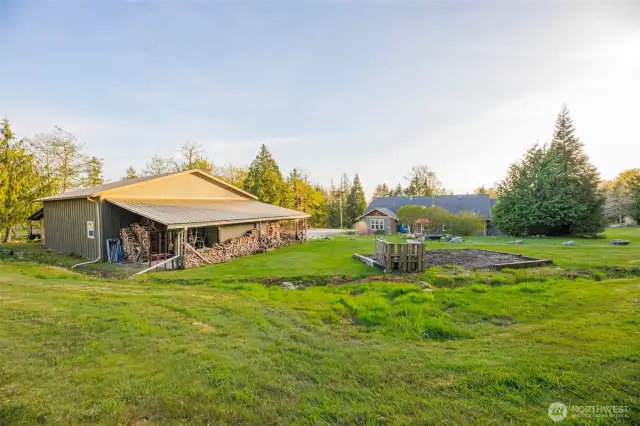 Shop with wood storage & lean to.