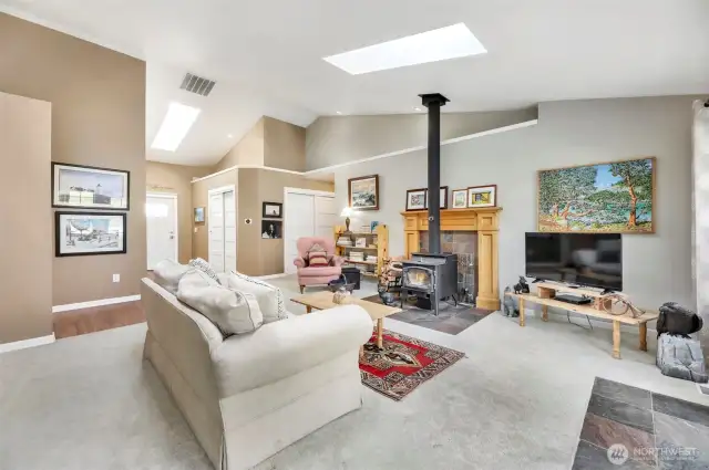 Enter into a bright living room with skylights.