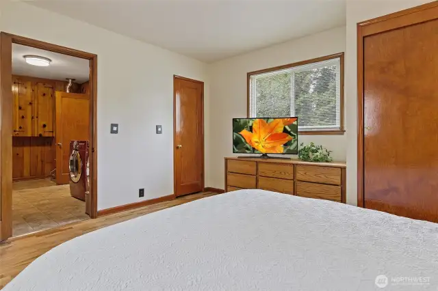 Looking back at laundry, there are three closets in this primary bedroom.
