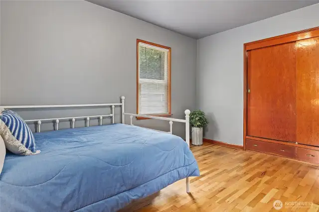 2nd bedroom showing double closet with built in drawers below