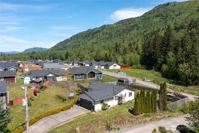 From the angle in this aerial shot, it’s really clear how lovely the area behind the house is. Beautiful green space.