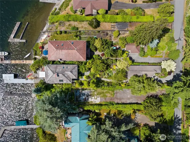 This magnificent and impeccable home offers a combination of quiet solitude, level property with extensive parking all on a peaceful rare waterfront dead-end lane.