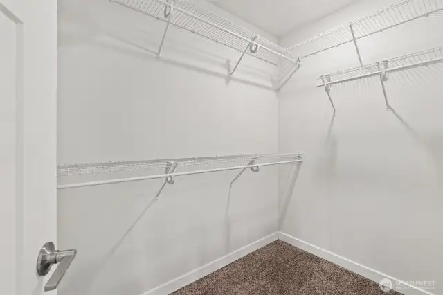 From seasonal wardrobes to everyday essentials, the spacious walk-in closet keeps it all in order.