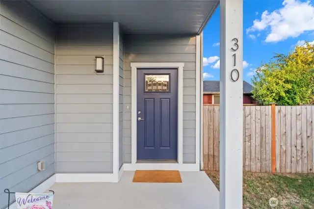 Covered porch welcomes you home with room to showcase your seasonal style.