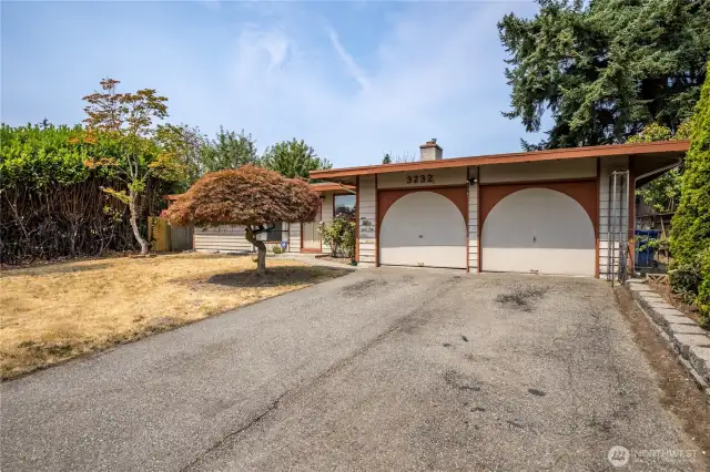 Welcome home to this classic rambler with attached 2-car garage and a big yard