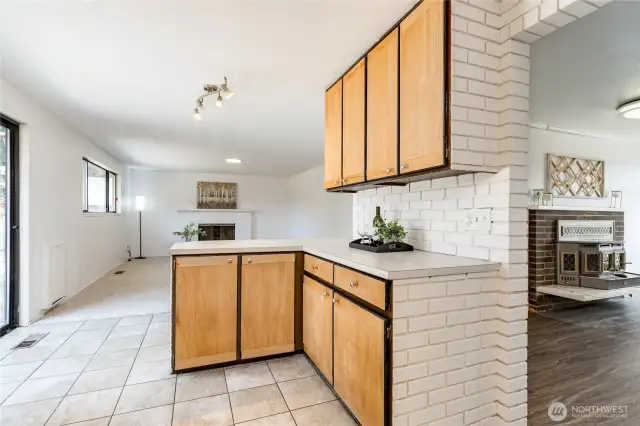 Kitchen is centrally located between family and living rooms