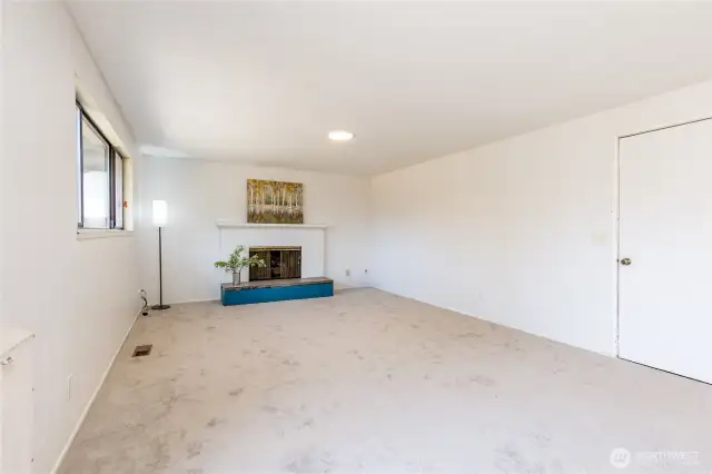 Family room has brand new carpet! Garage access to the right.
