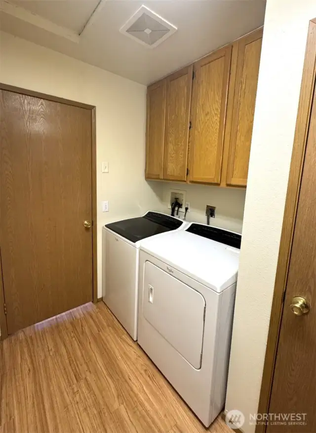 Laundry area with door to dampen operational noise