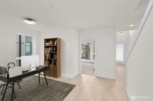 This photo is virtually staged.   Upon entry, you are greeted by two guest bedrooms + flex space, which can be used as a home office! This image is virtually staged.
