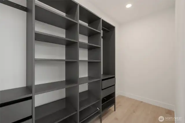 Pre-installed shelving is ready to go in the large primary walk-in closet!