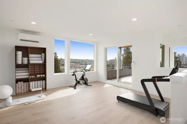 Above, the penthouse space can truly be utilized however you'd like. This image is virtually staged.