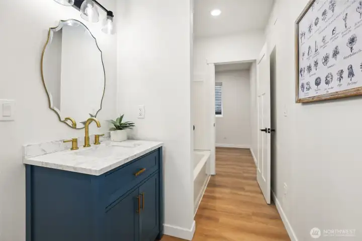 basement bathroom with tub/shower combo is all new and ready for your guests.