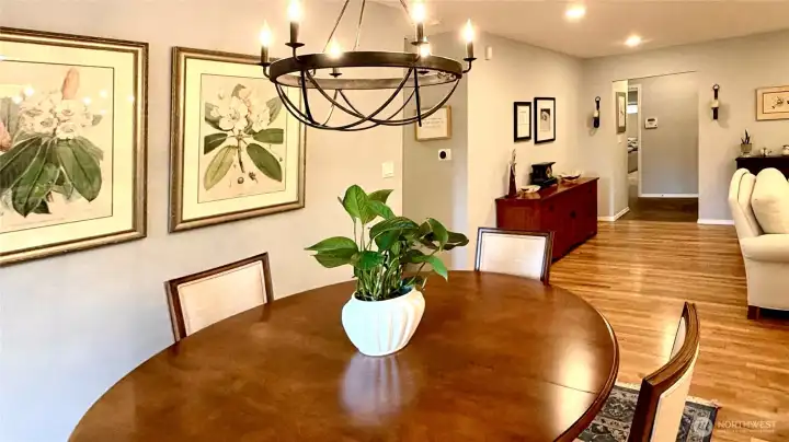 Sunny dining area with hardwoods and backyard outlook