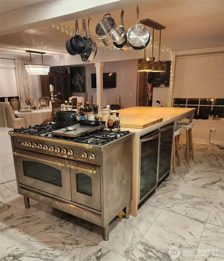 Huge island, custom range and two wine fridges