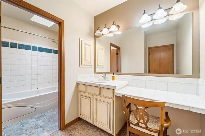 Unit A - Primary bedroom vanity and bathroom