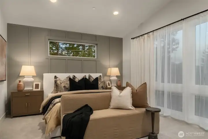 Spacious primary bedroom retreat with serene natural light.