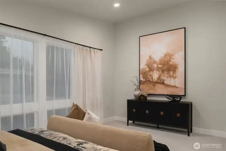 Primary bedroom offers comfort, space, and peaceful ambiance.