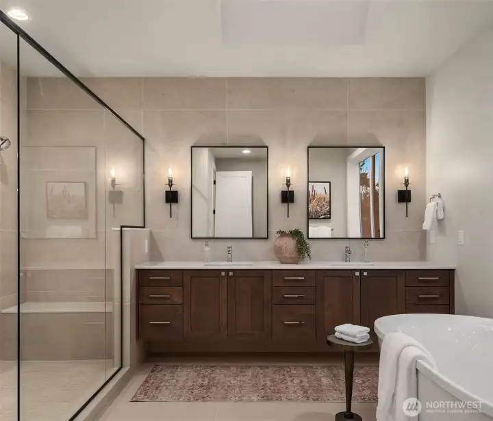 Spa-inspired primary bath with dual vanity and designer finishes.