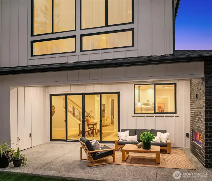 Outdoor patio extends living space for entertaining and lounging.