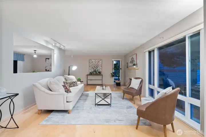 Enjoy relaxing or gathering in this light-filled living room with an open, airy feel.