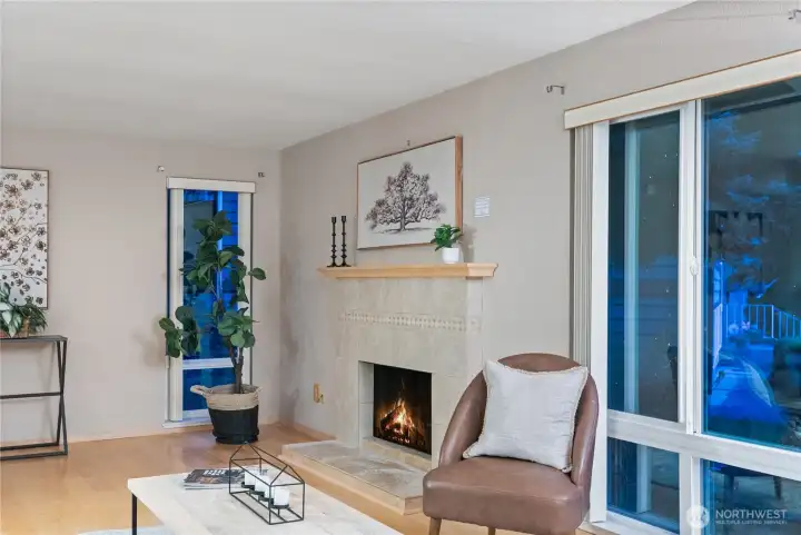 Cozy up by the fireplace and enjoy the warm, inviting ambiance of this living space.